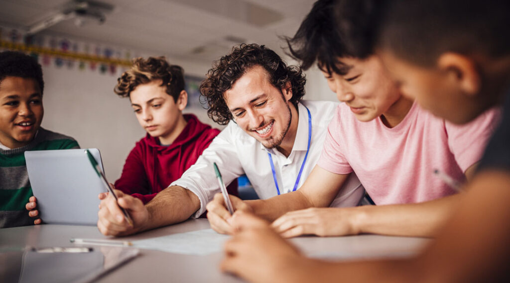 Private tutor helping students with their schoolwork.